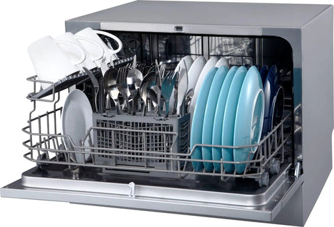 Compact Countertop Dishwasher Featuring Stainless Tub And Seven Quick Wash Options Handles Six Place Settings No Stress In Tight Spaces Energy Star Certified Silver Machine with dishes and utensils.