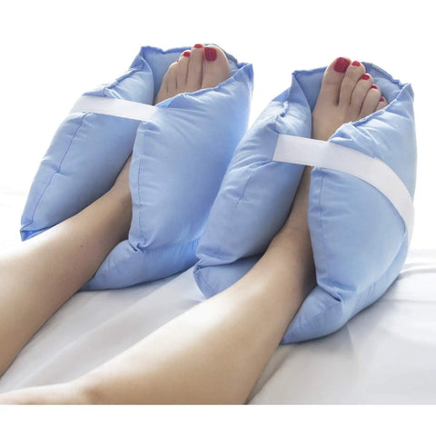 Foot Pain Relief Heel Cushion Protector Pillow Set Of 2 With Adjustable Velcro Straps shown on feet, blue and white color.