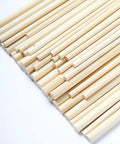 Hassle Free Pack Of Thirty Bamboo Dowel Rods And Wooden Craft Sticks Measuring Quarter Inch By Eight Inches Unfinished Natural Poles arrange neatly.
