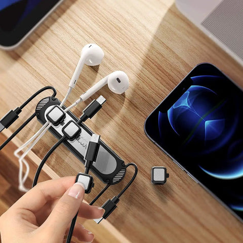 Magnetic Cable Holder Six Slot Cable Clips For Under Desk Self Adhesive Wire Organizer Black with cables and phone on desk