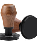 Heavy Duty Spring Loaded Espresso Coffee Tamper With Solid American Walnut Handle And Durable Titanium Base showing a close-up angle.
