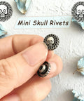 Top Shelf Badass Metal Skull Buttons And Screw Back Rivets For Leather Crafting 100 Pc Bulk Set close-up of mini skull rivets in hand.