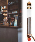 Heavy Duty Wall Mount Coffee Bean Dispenser Solid Stainless Steel Acrylic Pantry Jar with gold finish holding coffee beans.