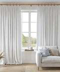 Wood Curtain Rod Set With Adjustable 36 To 120 Inch Length, 1 Inch Diameter, Imitation Wood Grain Finish over white curtains and sofa.