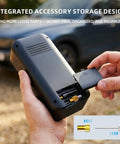 Close-up of hands holding cordless car tire pump with integrated accessory storage and attachments, fits cars and bikes.