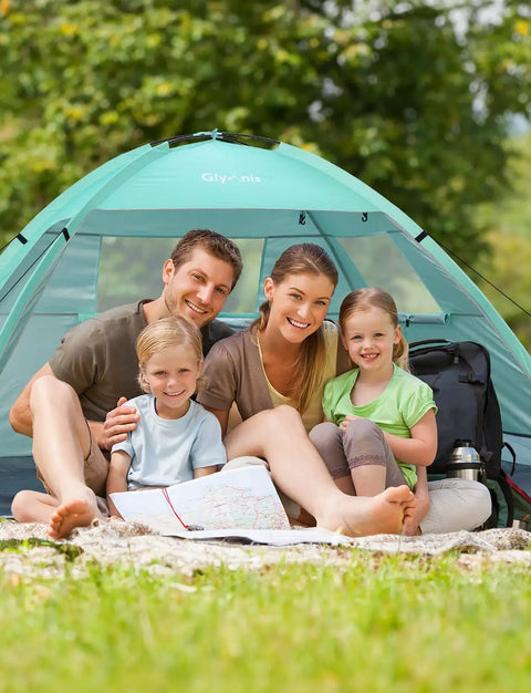 Family sitting in Beach Day Ready Sun Shelter For Three People With UPF Fifty Plus UV Protection Lightweight Easy Setup Shade Canopy.
