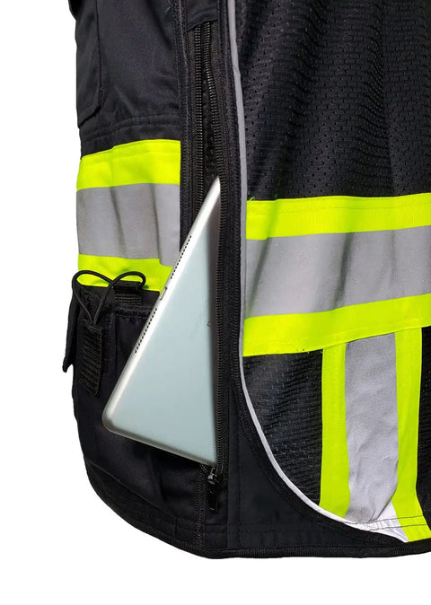 Pro Level Ansi Class One Safety Vest For Surveyors In Matte Black with visible tablet slot and high vis reflective trim.
