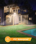 10 Pack LED Flood Lights Outdoor 300W Ultra Bright Security Lighting With IP65 Weatherproof Rating For Yard And Barn, Warm White Glow illuminating a house in rain.