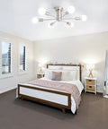 Dope Six Light Sputnik Style Ceiling Fixture In Brushed Nickel Finish in a bedroom setup with modern decor