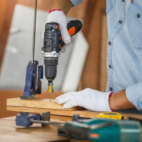 Person using a drill with a yellow dovetail bit on wood, showcasing the Top Tier Four Piece Dovetail Router Bit Set Featuring Precision Bearing Guides For Cabinetry And Fine Woodworking Delivers Straight Up Precision When Run Through CNC Machines Or Standard Routers.