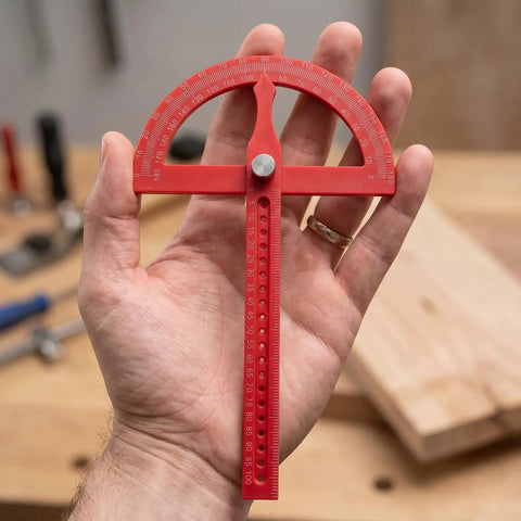 Heavy Duty Angle Finder With Dead Nuts Secure Locking Swing Arm Reads Zero To One Eighty Degrees held in hand for precise angle measurements.