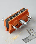 Vertical Hole Opener Dowel Jig Drill Guide Clamp Alloy Body Extended Model with drill bits and ruler on work surface.
