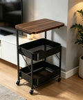 Versatile 2 Tier Rolling Utility Cart With Solid Wood Top And Reinforced Steel Mesh Basket Hella Sturdy Storage Trolley Smooth Glide Kitchen Organizer And Small Space Daily Flex next to a TV.