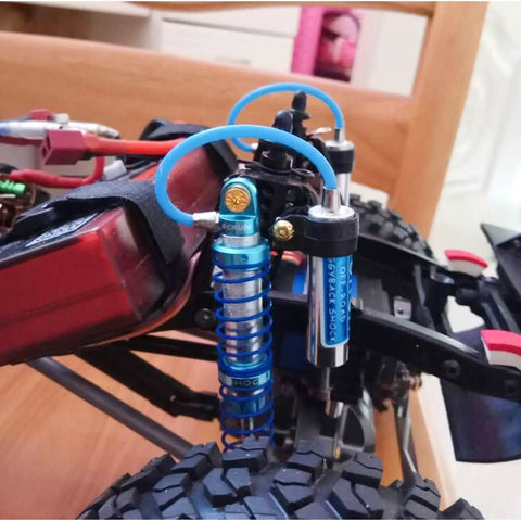 Adjustable Oil Piggyback RC Shock Absorber 70-123mm with Remote Reservoir on Axial SCX10 crawler, CNC aluminum.