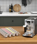 Clear Acrylic K Cup Drawer Organizer For Drawer And Countertop Storage Holds 24 K Cup Coffee Pods Sleek Flat Tray Design For Office And Kitchen Counter 9.6 By 13.2 Inches next to a coffee machine on a kitchen counter