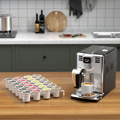 Clear Acrylic K Cup Drawer Organizer For Drawer And Countertop Storage Holds 24 K Cup Coffee Pods Sleek Flat Tray Design For Office And Kitchen Counter 9.6 By 13.2 Inches next to a coffee machine on a kitchen counter