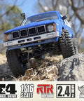 All Terrain 1/16 Scale RC Rock Crawler 4x4 Ready To Run Pickup Truck with LED Lights on rugged terrain