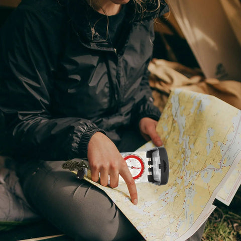 Person using Trail Ready Orienteering Compass With Ruler And Mirror, Small Portable Hiking Navigator For Camping And Backpacking