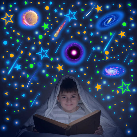 Child reading under 495 Piece Glow In The Dark Moon And Star Wall Decals For Ceiling And Walls Removable Galaxy Planets Space Stickers