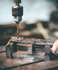 Close-up of drill press using a 29-Piece M35 Cobalt Drill Bit Set For Steel And Hardened Metals, 1/16 To 1/2 Inch Bits