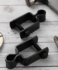 Heavy Duty Square Post Female Gate Hinges For Chain Link Fences Black Hot Dipped Galvanized Steel With Bolts on wooden surface.