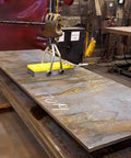 Heavy Duty Switchable Lifting Magnet With 12000 Pounds Breakaway Force lifting a steel plate in a workshop setting.