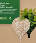 Eco-friendly packaging design promoting carbon neutrality with leafy cutout and soy ink certification symbol.