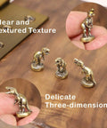 Magnetic Hinge Head T Rex Set Of 3 Miniature Door Topper Figures for Standard Hinges, copper dinosaur decor on wood surface.