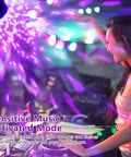 Glow Party Black Light 6W LED Disco Ball Strobe Light Kit with Sound Activated Modes illuminating a DJ setup in vibrant colors
