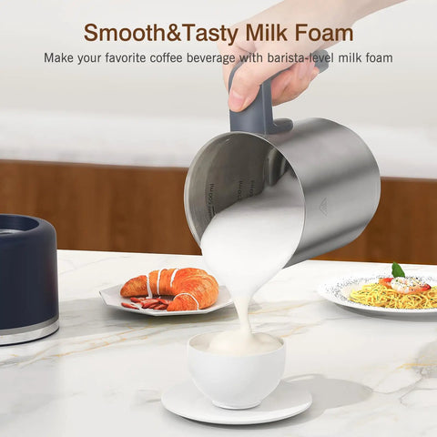 Hand pouring milk foam into cup using 4 In 1 Electric Milk Frother And Steamer, 16.9 Oz Capacity, on kitchen counter.