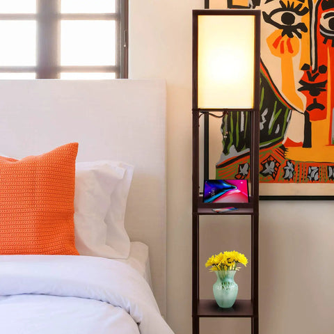Dope Shelf Floor Lamp With USB Ports And Wireless Charging Pad And Outlets next to bed in bedroom with art and flowers