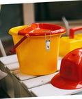 Red and yellow plastic bucket with Sturdy Stainless Steel Toggle Latch Fasteners Set With Extended Hook Locks, helmet beside.