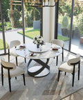 Modern 51 Inch Round Dining Table Slick Glossy White Sintered Stone Top Built Tough Black X Carbon Steel Base Lazy Susan with floral centerpiece.