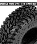 Close-up of 1.0 Inch Maverix MT Tires 57x22mm for 1/18 and 1/24 RC Crawlers showing aggressive hook tread design.
