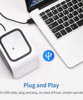 Fast 1D And 2D Barcode Scanner For Quick Mobile Payments And Desktop Use shown connected to laptop via USB