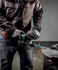 Killer 18V Cordless Belt File With Brushless Motor And Variable Speed Control for precise metalworking in action, creating sparks.