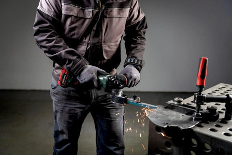 Killer 18V Cordless Belt File With Brushless Motor And Variable Speed Control for precise metalworking in action, creating sparks.