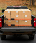 Heavy Duty Adjustable Support Pole Cabinet Jack Drywall Lift 45 To 114 Inch supporting cargo boxes in truck bed.