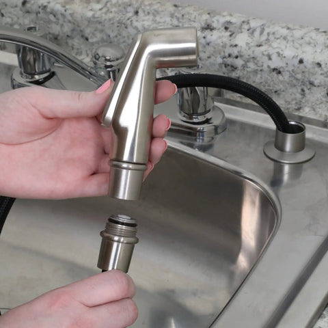 Brushed Nickel Kitchen Sink Side Spray Head 1 Pack With Easy On Off Thumb Control, shown being installed on faucet