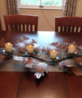 Flameless Votive Candles With Timer Real Wax 2 By 2 Battery Operated 6 Pack on a leaf-shaped table centerpiece