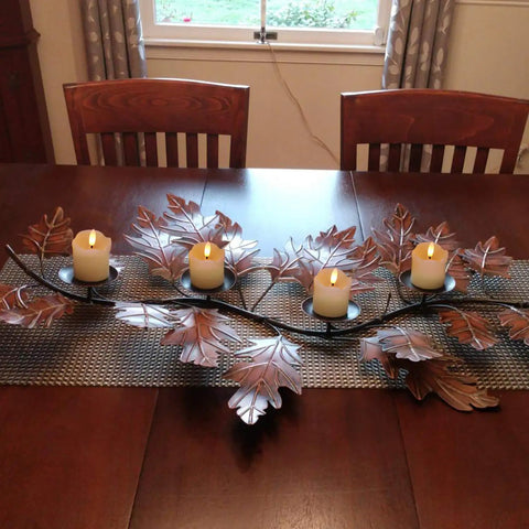 Flameless Votive Candles With Timer Real Wax 2 By 2 Battery Operated 6 Pack on a leaf-shaped table centerpiece