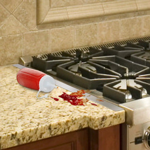 Stainless Steel Stove Gap Covers 2 Pack For Kitchen Counter Gaps with spilled ketchup on granite countertop and stove