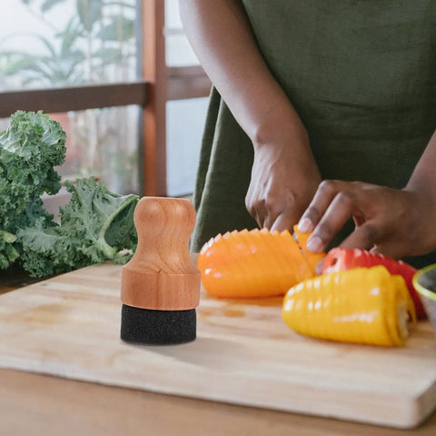 Straight Up Amazing Wooden Cutting Board Oil Brush And Built Tough Wood Wax Applicator Sponge on a kitchen counter with chopped vegetables.