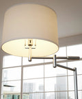 Detail of Theta Swing Arm Floor Lamp With Brushed Steel Finish, drum shade, two adjustable arms in modern reading light design.