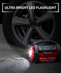 Portable Tire Inflator Air Compressor With Dual Motors, 12V DC And 110V AC, shown with LED light near car tire
