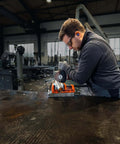Built Tough 18 Volt Cordless Angle Grinder in use, cutting metal with 125mm disc, sparks flying, tool only without battery.