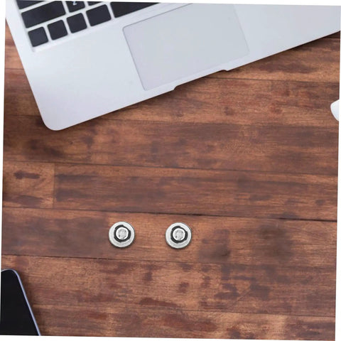 Two Ten Pack Hella Secure Self Tapping PC Case Screws on a wooden table with a laptop nearby.