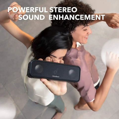 Close-up of 3 Portable Bluetooth Speaker That Delivers Dope Sound With IPX7 Waterproof Build held by two people indoors.