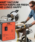 Ortis Vacuum Switch orange plug-in dust-control autoswitch for two tools; front view with table saw.