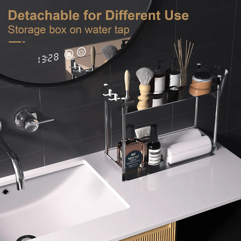 Stainless steel bathroom countertop storage rack with toiletries, towels, and detachable feature, next to sink faucet.